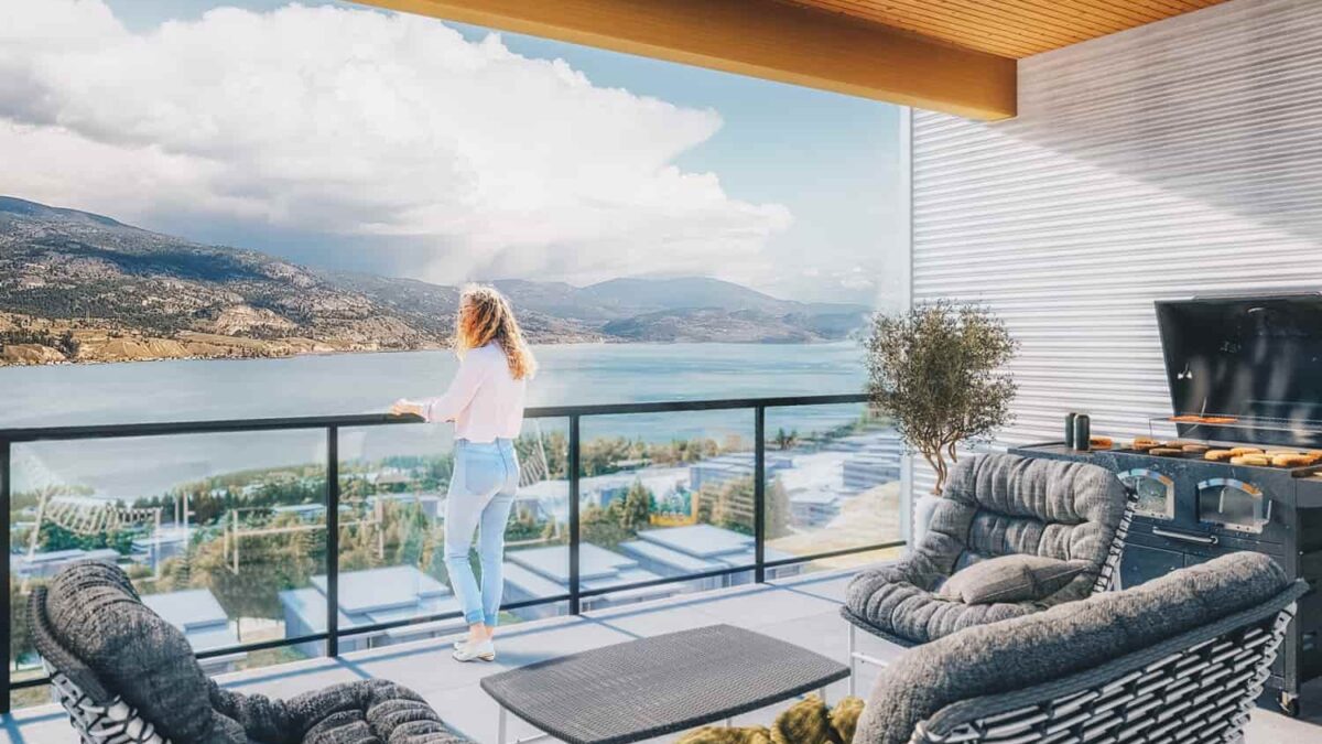 Woman on balcony with view of Skaha Lake at Skaha Hills Penticton