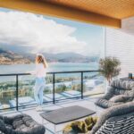 Woman on balcony with view of Skaha Lake at Skaha Hills Penticton