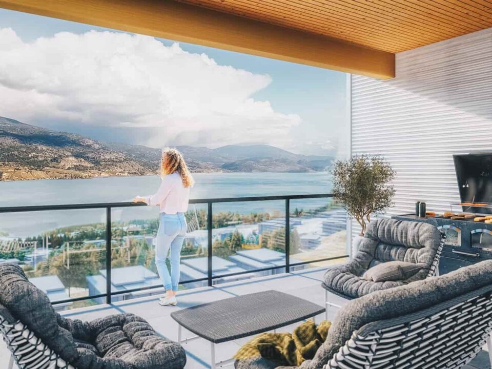 Woman on balcony with view of Skaha Lake at Skaha Hills Penticton
